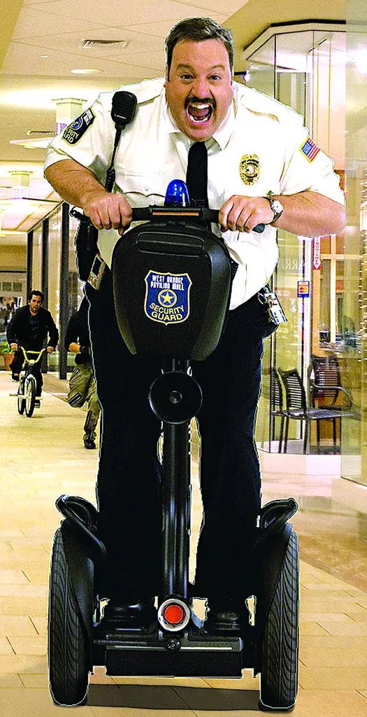 Paul Blart riding a segway